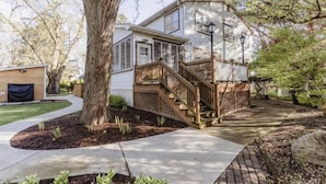 A two-story house with a wooden deck and a covered porch. - Beach Access Steps Away, Hot Tub, Sleeps 12, Fire Pit (Union Pier)