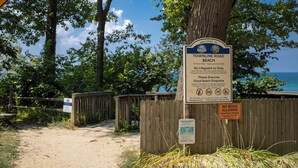 A beach entrance sign with guidelines and a no dogs allowed sign. - Beach Access Steps Away, Hot Tub, Sleeps 12, Fire Pit (Union Pier)