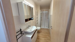 Shower, eco-friendly toiletries, hair dryer, towels