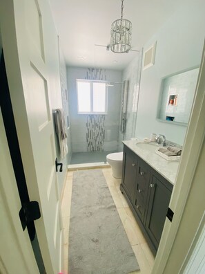 Shower, hair dryer, towels, soap