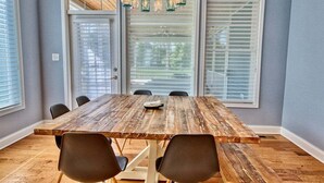 A dining room with a wooden table, four chairs, and a chandelier. - *Private Hot Tub* 4BR Luxury Beach Home *37096* (Lewes)