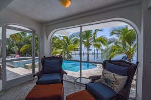 A heated pool, sun loungers