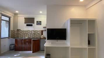 Superior Studio Suite, Non Smoking, Garden View | Living area | Flat-screen TV, printers