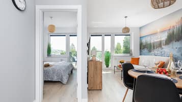 Superior Apartment | Living area | 50-inch LED TV with satellite channels, TV