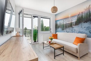 Superior Apartment | Living area | 50-inch LED TV with satellite channels, TV