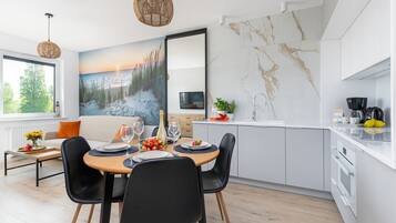 Superior Apartment | Living area | 50-inch LED TV with satellite channels, TV
