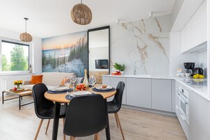 Superior Apartment | Living area | 50-inch LED TV with satellite channels, TV