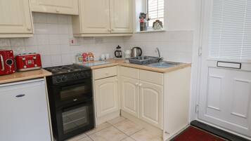 Fridge, electric kettle, toaster, cookware/dishes/utensils