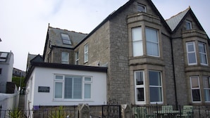 A stone building with a sign reading "Lyonse Apartments."