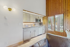 Enjoy a meal while taking in the view of the surrounding trees from the kitchen window.