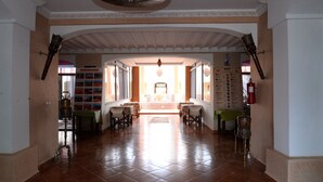 A spacious lobby with a tiled floor, a central seating area, and a decorative ceiling. - Relais d'ourika (Oulad Dlim)
