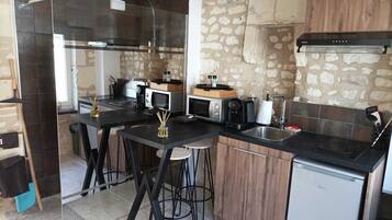 Fridge, microwave, stovetop, coffee/tea maker
