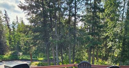Home nestled in a private forest setting, mountain views, walk to Kenai Lake.