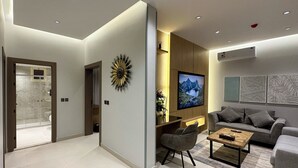 Deluxe Apartment, 3 Bedrooms | Living area | 75-inch Smart TV with satellite channels, offices - Mehad Stay for Self Check-In Apartment (Jeddah)