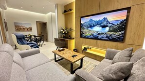 Deluxe Apartment, 3 Bedrooms | Living area | 75-inch Smart TV with satellite channels, offices - Mehad Stay for Self Check-In Apartment (Jeddah)