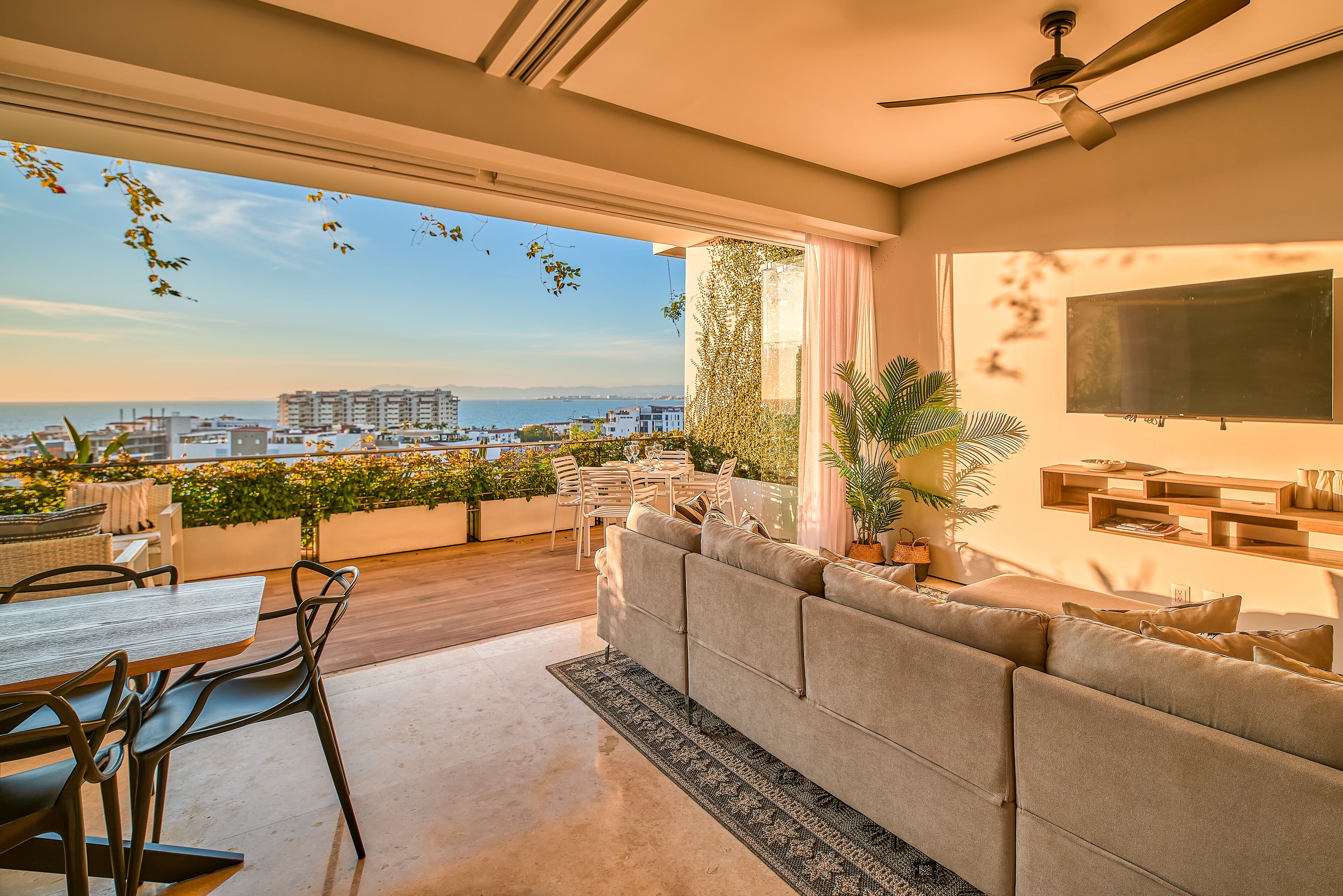 Deluxe Apartment, Terrace, Ocean View | Living area | 50-inch Smart TV with digital channels, TV