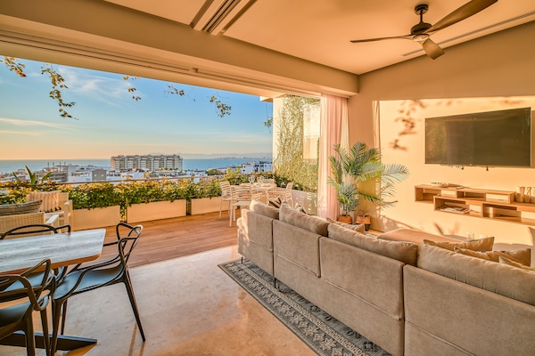 Deluxe Apartment, Terrace, Ocean View | Living area | 50-inch Smart TV with digital channels, TV
