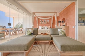 Deluxe Apartment, Terrace, Partial Ocean View | Living area | 50-inch Smart TV with digital channels, TV - Maxwell Collection Romantic Zone (Puerto Vallarta)