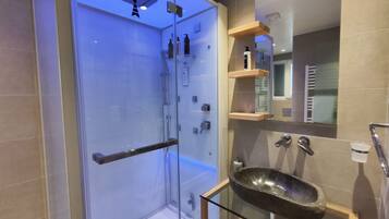 Mykonos | Bathroom | Shower, rainfall showerhead, hair dryer, towels