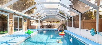 Home with play room, enclosed pool . Only 10 minutes from the beach!
