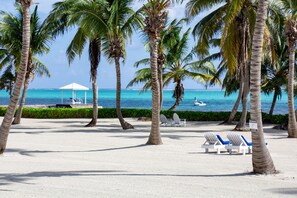 On the beach, sun loungers, beach towels