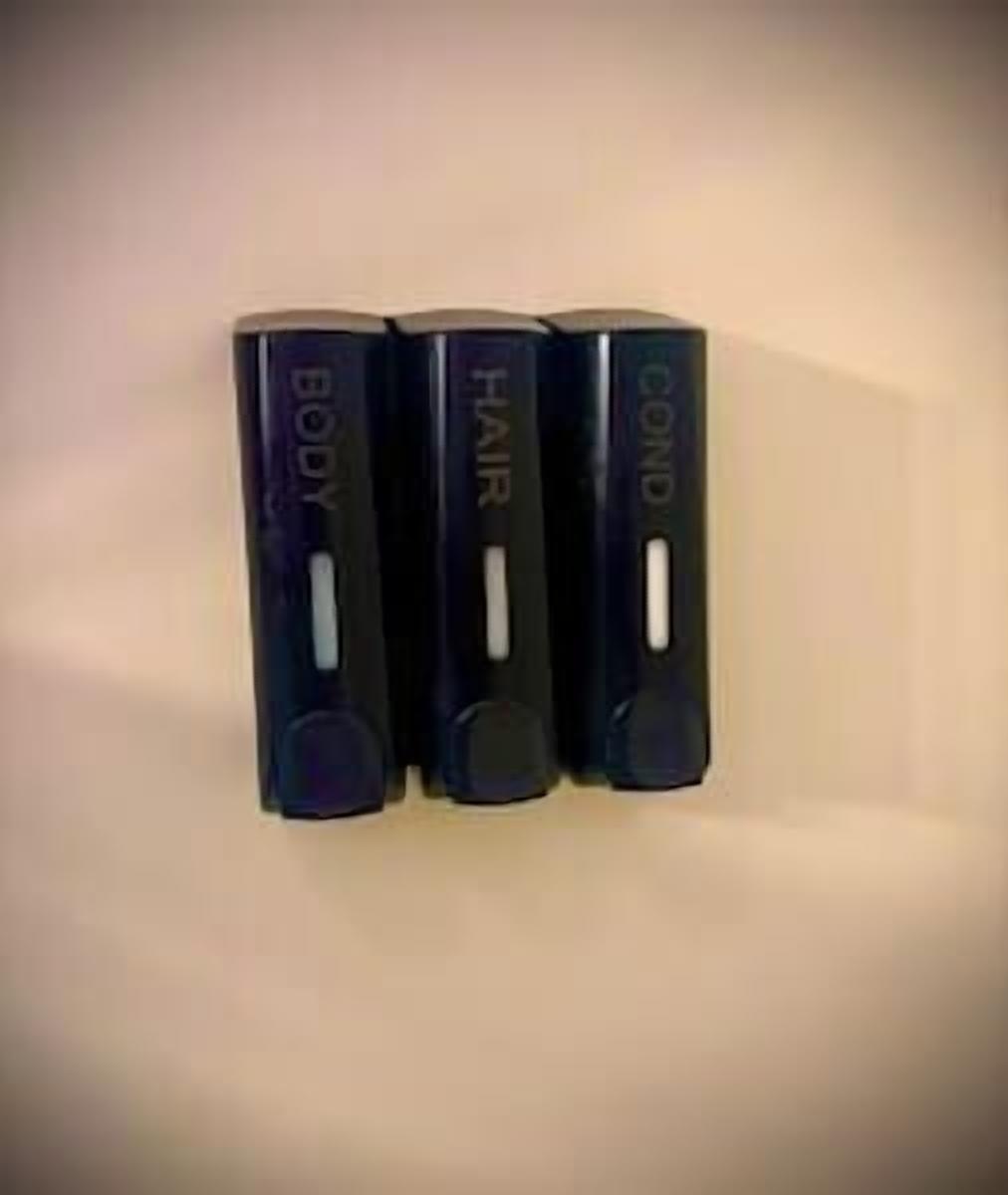 Three black containers labeled "BODY," "HAIR," and "COND" against a plain background.