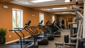 A gym with treadmills, weight machines, and a motivational poster. - Beautiful Lodge in The Hideout!! (Lake Ariel)