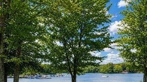 A lakeside park with picnic tables, benches, and a walking path. - Beautiful Lodge in The Hideout!! (Lake Ariel)
