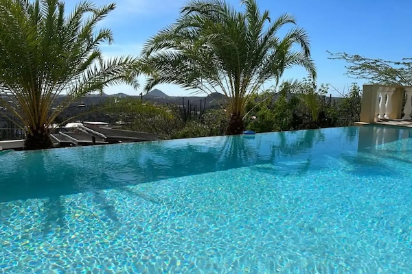 Escape to paradise and indulge in the luxury of our private pool area with infinity pool, sun longes and parasols.
