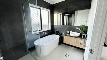 Shower, hair dryer, towels, soap
