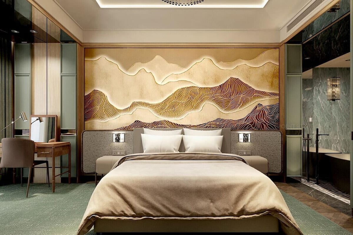 A modern hotel room with a large bed, a desk, and a unique wall mural.