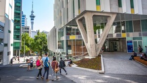 A modern building with a unique architectural design, featuring a prominent concrete structure. - Convenient Studio Steps from AUT University (Auckland)