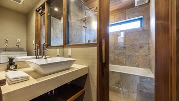 City Townhome | Bathroom | Combined shower/tub, hair dryer, slippers, electronic bidet