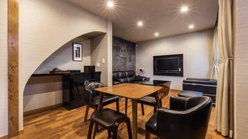 City Townhome | Living area | 55-inch flat-screen TV with digital channels, TV