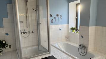 Shower, hair dryer, towels, soap