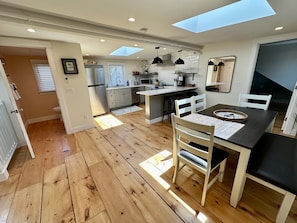 Enjoy meals at the dining table with comfortable seating.