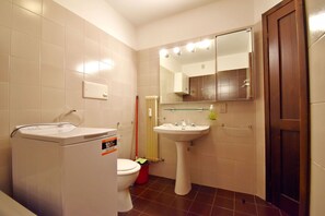 Bathtub, hair dryer, towels