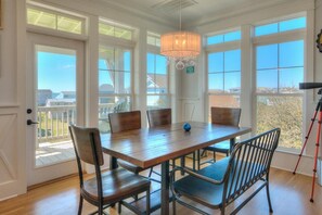 Dining - Experience ocean views at Blue Waves, a spacious 4-bedroom home in Oak Island! (Oak Island)