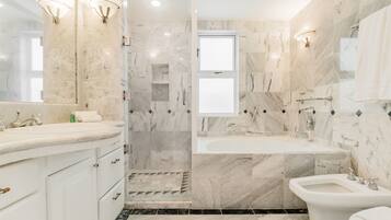 Shower, jetted tub, hair dryer, bidet