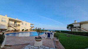 A modern residential complex with a swimming pool, a well-maintained lawn, and a clear view of the sea. - Mediterranean Lookout From Vinaròs (Vinaròs)