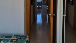 A hallway leading to a balcony with a view of the sea. - Mediterranean Lookout From Vinaròs (Vinaròs)