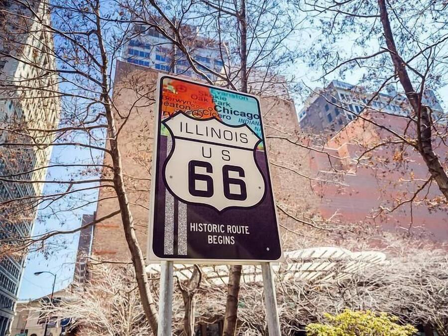 A sign for Illinois US Route 66 with a historic route marker.
