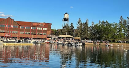 Spacious Summer Escape: Private Backyard, Dock & Fire Pit, Channel Waterfront