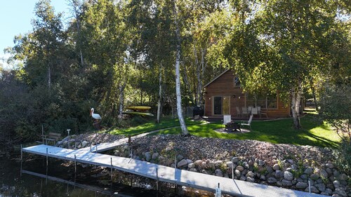 Spacious Summer Escape: Private Backyard, Dock & Fire Pit, Channel Waterfront