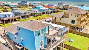 A coastal residential area with multiple two-story houses featuring balconies and waterfront views. - Beach Please (Surfside Beach)