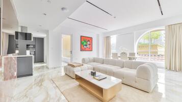 Luxury Apartment, 1 Bedroom, Balcony | Living area | 75-inch LED TV with satellite channels, TV, Netflix