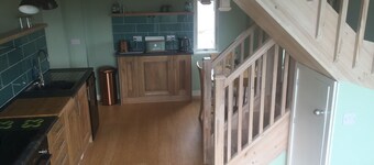 Unique tiny house within own grounds. Ideal village location with sea/hill views