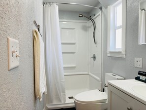 Shower, hair dryer, towels