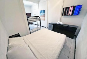 1 bedroom, desk, bed sheets