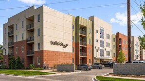 A multi-story apartment building with a sign reading "trailside45". - The Found Boutique 1 bdrm haven for relaxation. (Traverse City)